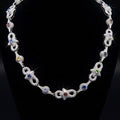 18k white gold plated iced multi shape necklace.