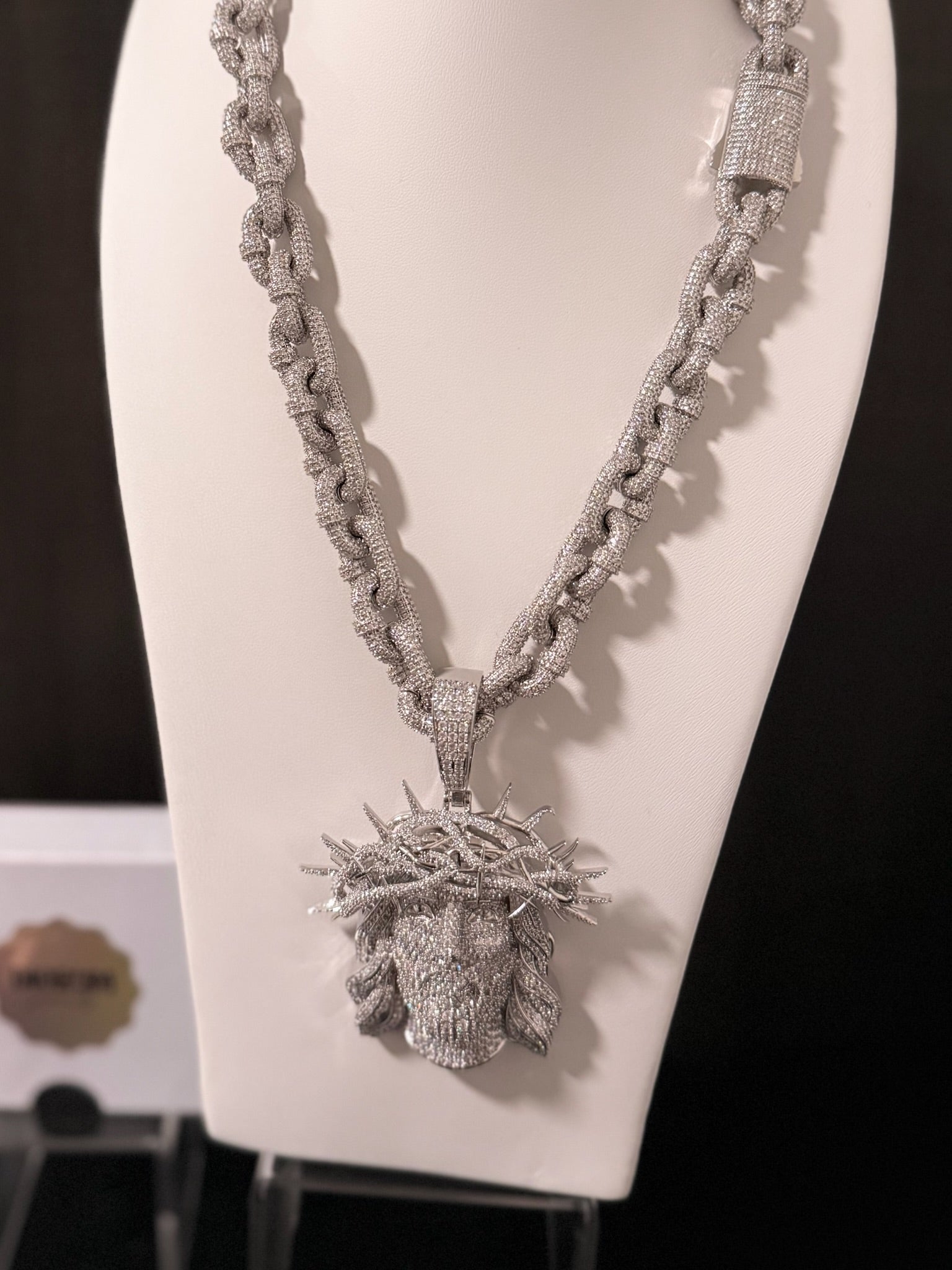 White gold plated iced link necklace and Micro pave god face pendant.