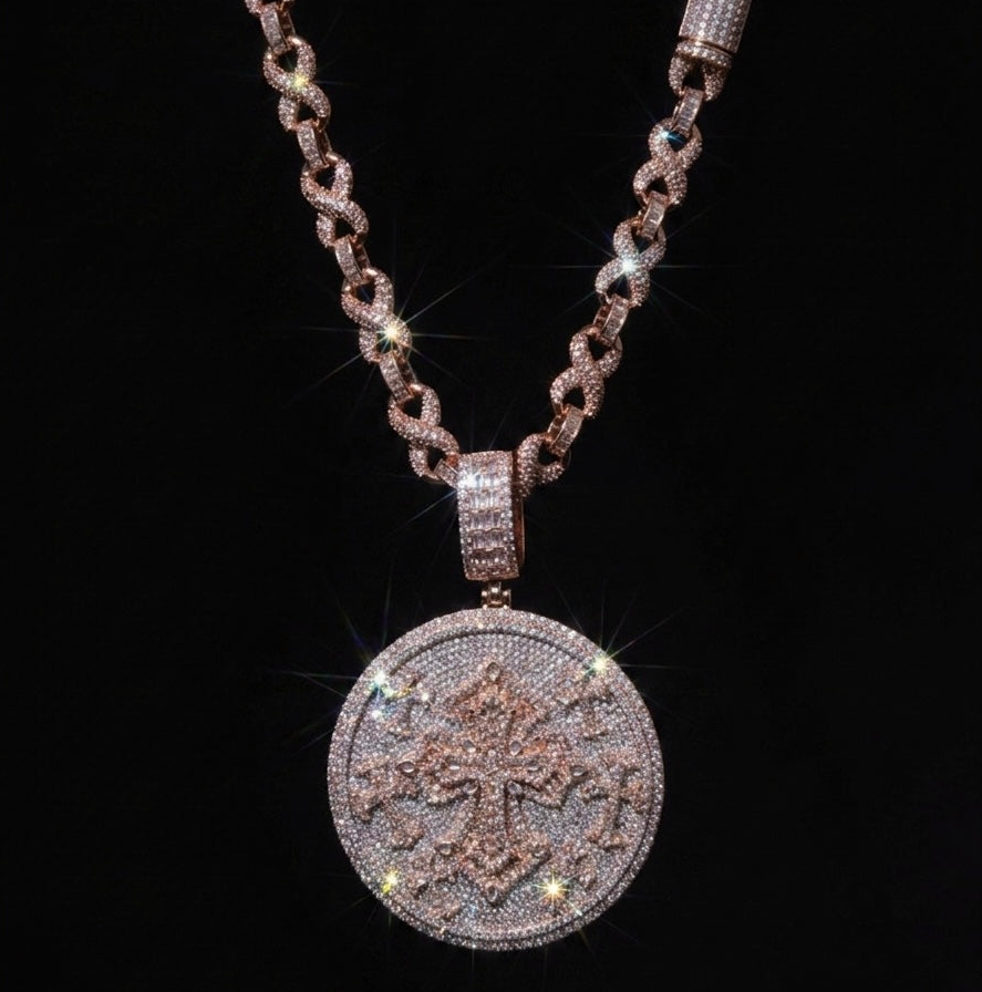 18k rose gold plated iced infinity chain and coin pendant.