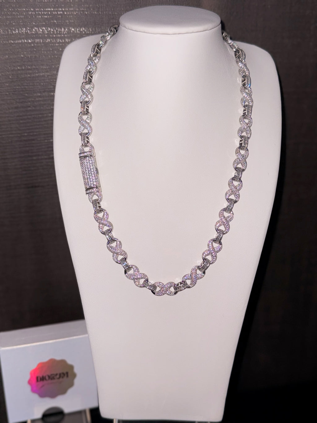 18k white gold plated iced infinity necklace.