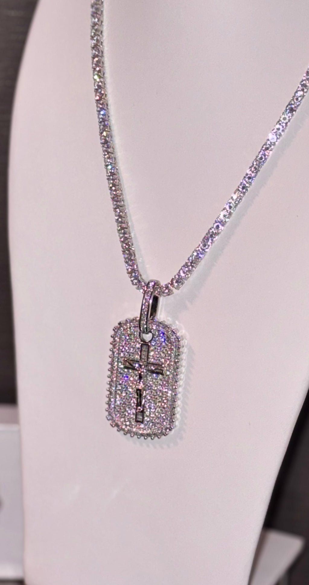 18k white gold plated tennis chain and iced dog tag pendant.