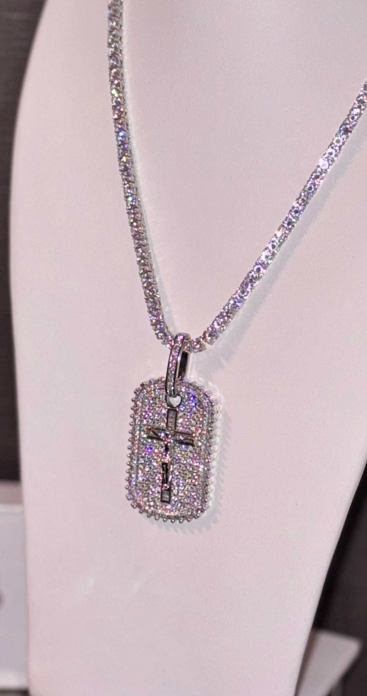 18k white gold plated tennis chain and iced dog tag pendant.