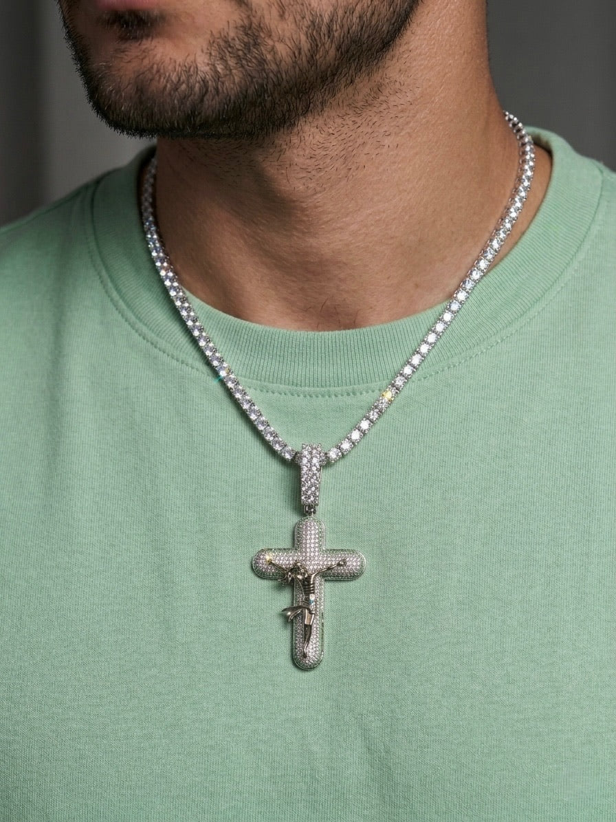 White gold plated tennis chain and icy cross pendant.