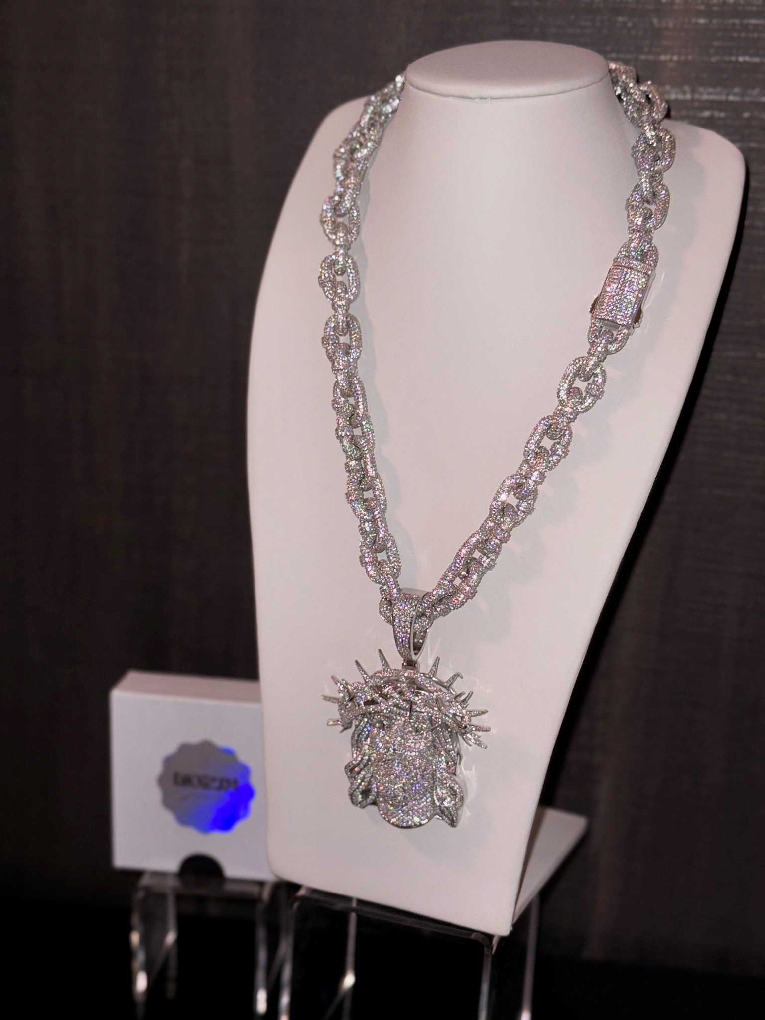 White gold plated iced link necklace and Micro pave god face pendant.