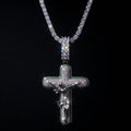 White gold plated tennis chain and icy cross pendant.
