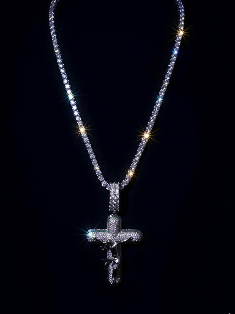 White gold plated tennis chain and icy cross pendant.