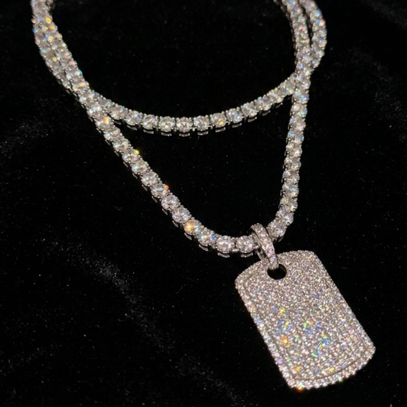 White gold plated tennis necklace and iced tag pendant.