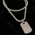 White gold plated tennis necklace and iced tag pendant.