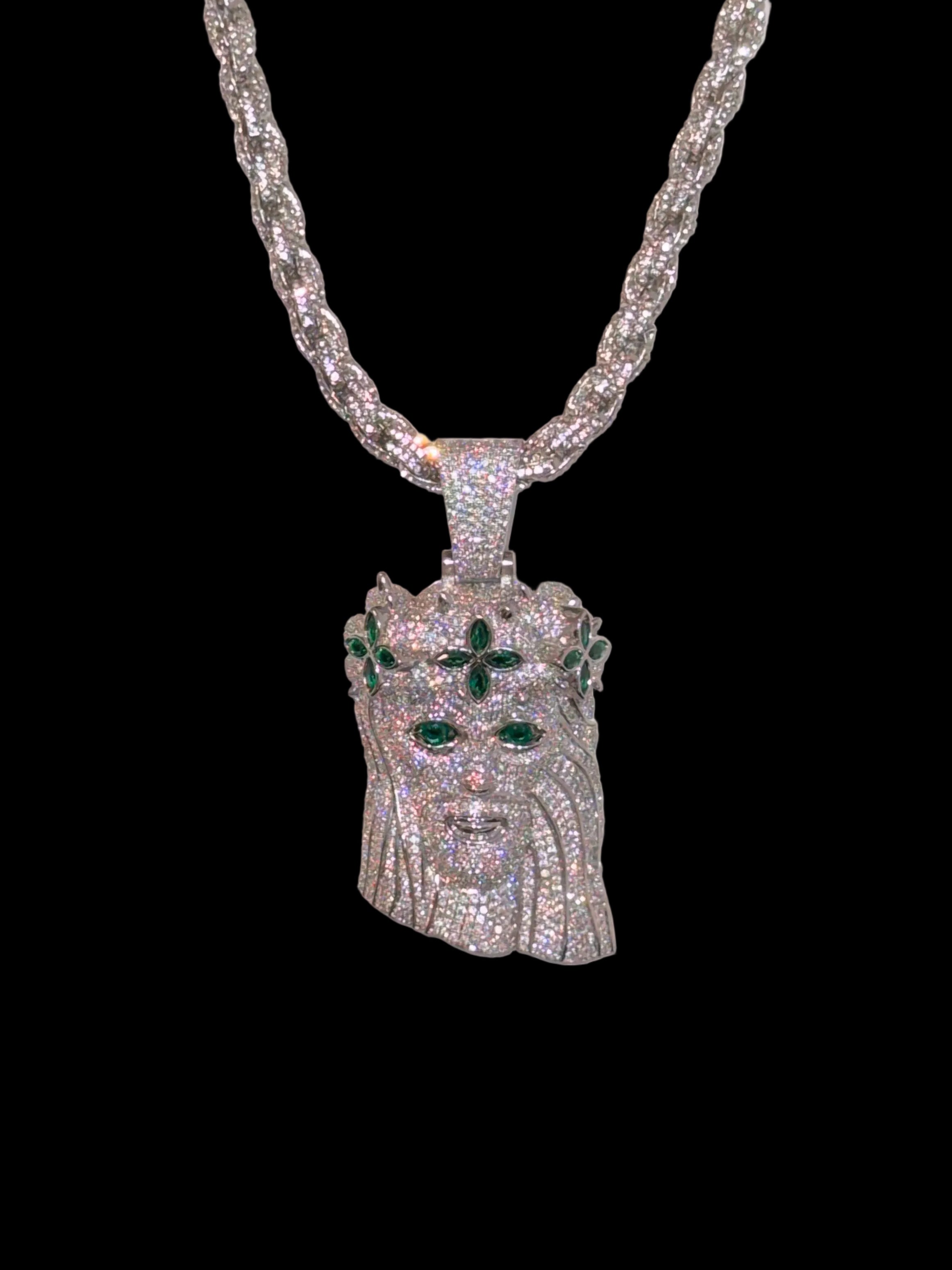 White gold plated iced rope chain and god face pendant.