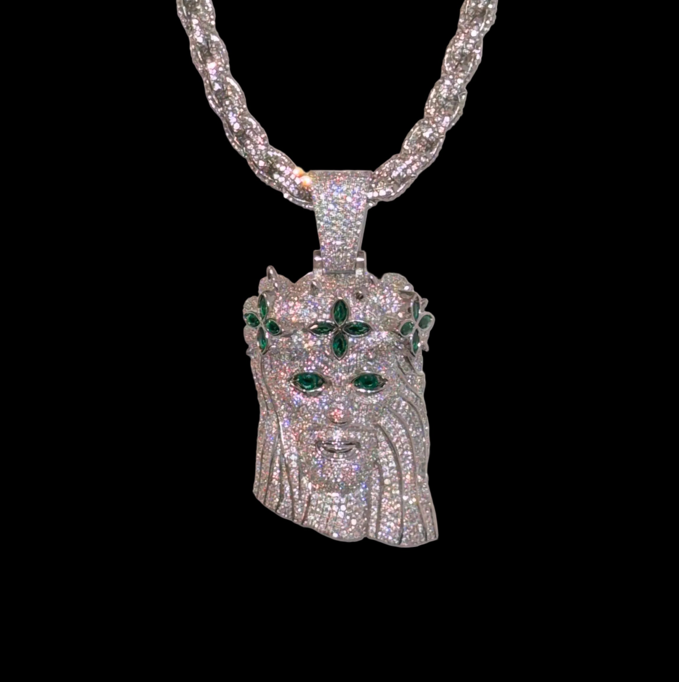 White gold plated iced rope chain and god face pendant.