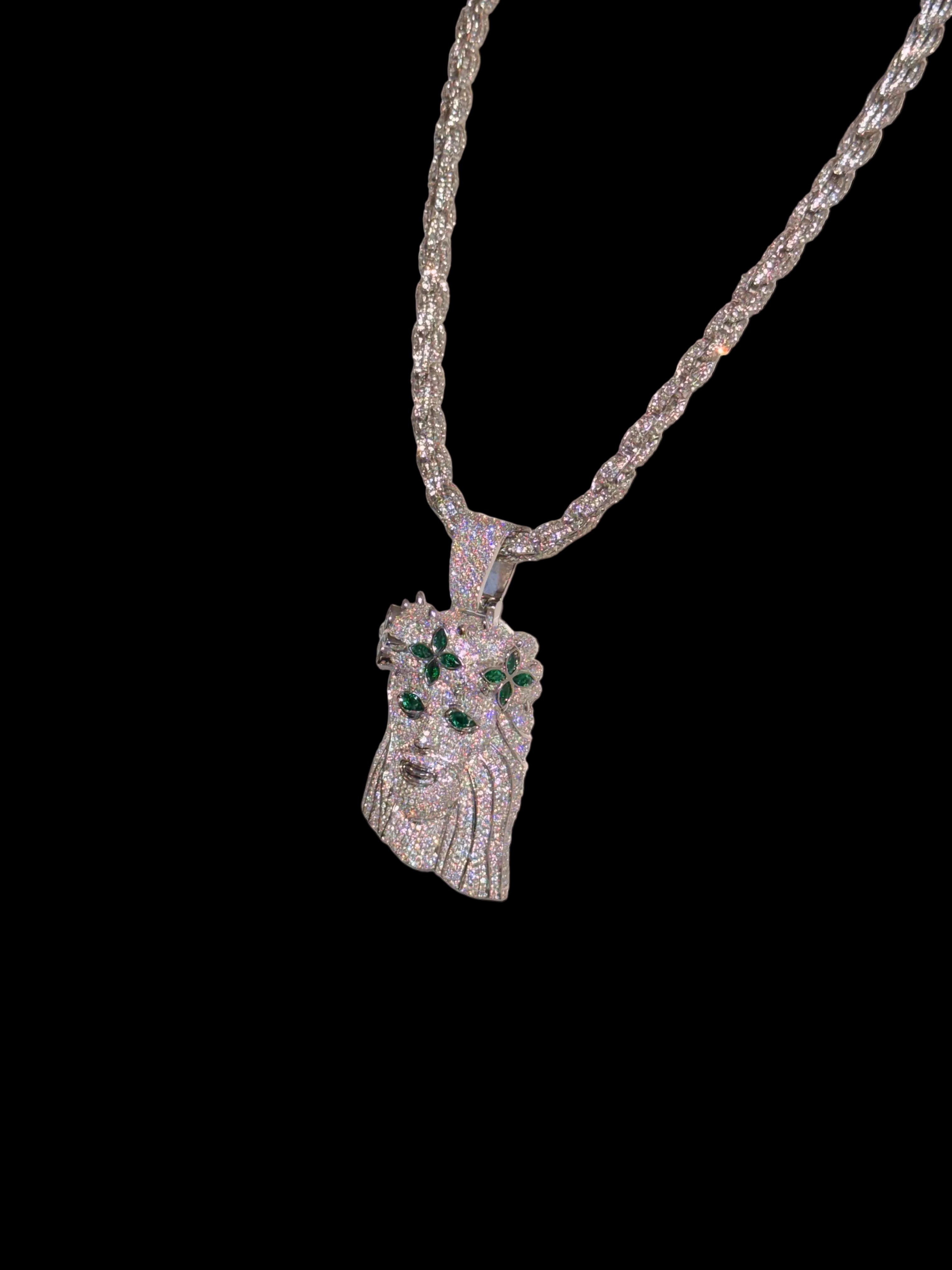 White gold plated iced rope chain and god face pendant.
