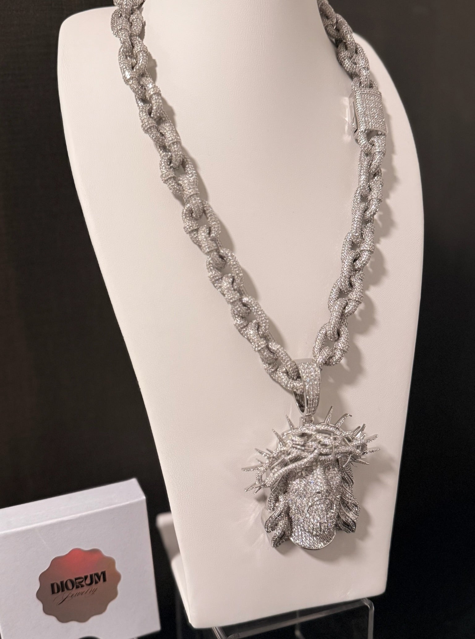 White gold plated iced link necklace and Micro pave god face pendant.