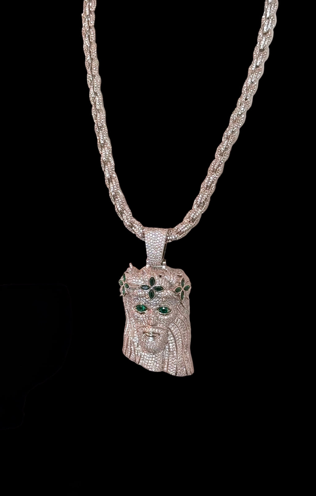 White gold plated iced rope chain and god face pendant.