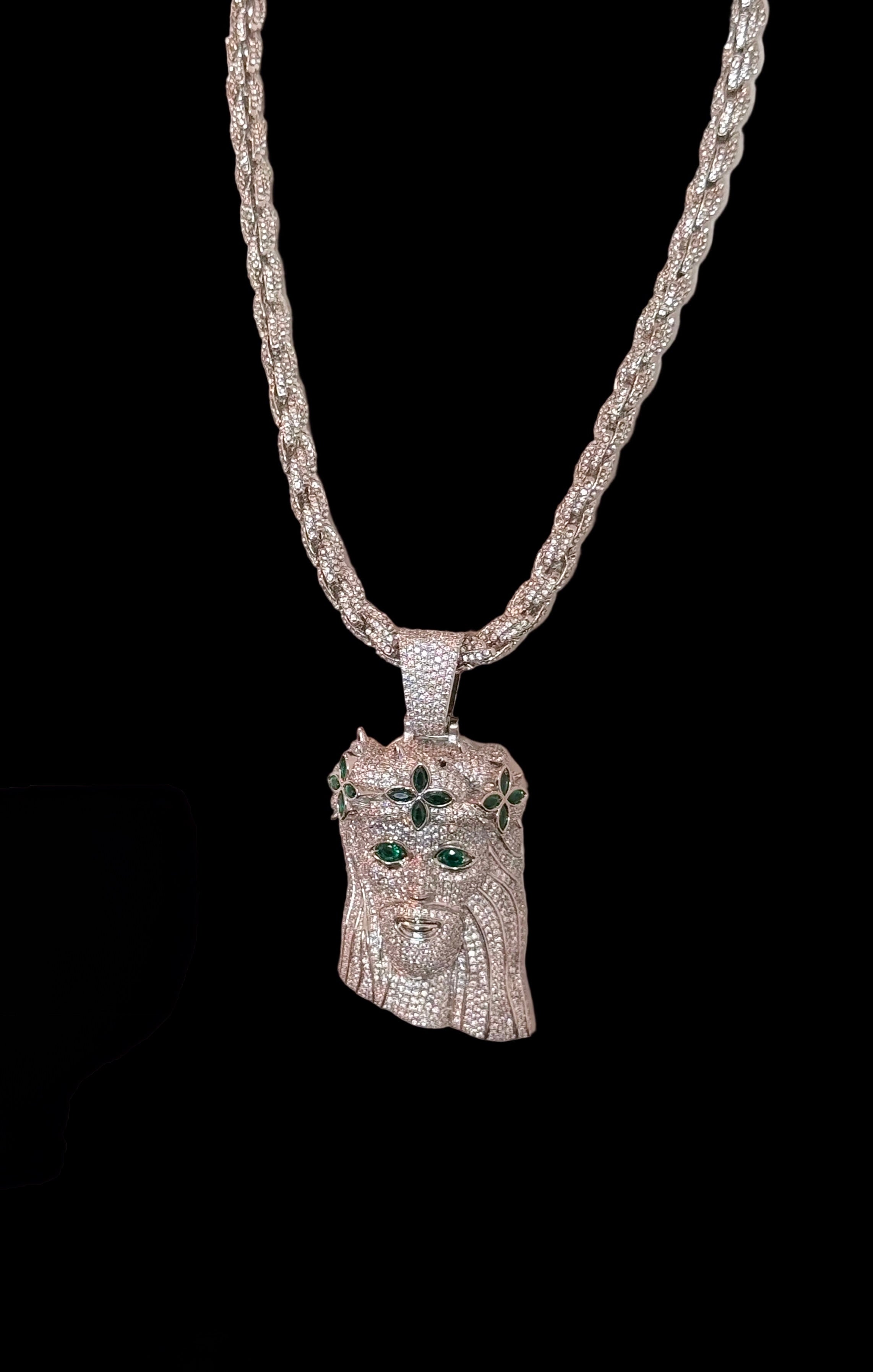 White gold plated iced rope chain and god face pendant.