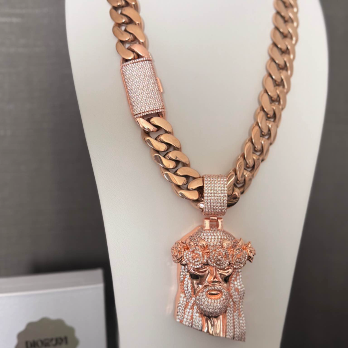 Stainless steel 18k rose gold plated Cuban link and Jesus pendant.