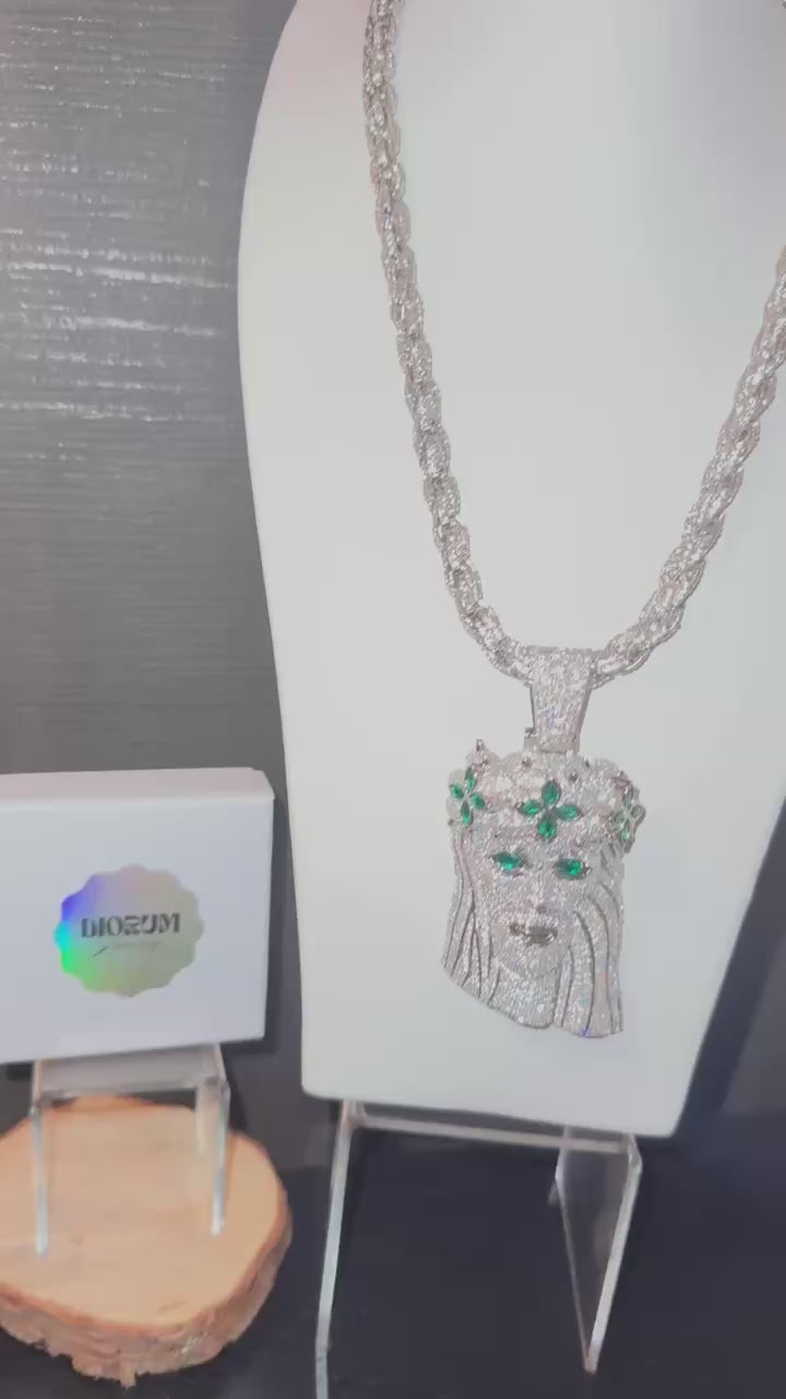 White gold plated iced rope chain and god face pendant.
